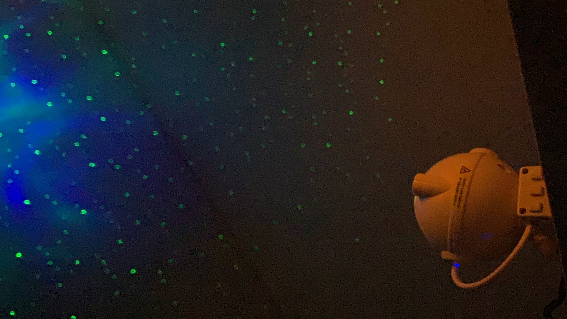 Blue and green star field projected on a ceiling, real customer photo