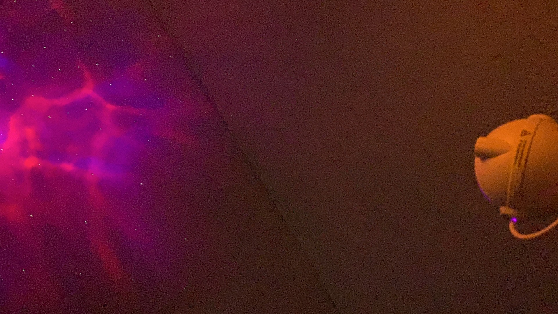 Pink and purple nebula light effect on a ceiling, real customer photo